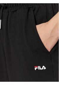 Fila Spodnie dresowe FAW0559 Czarny Relaxed Fit. Kolor: czarny. Materiał: bawełna, dresówka