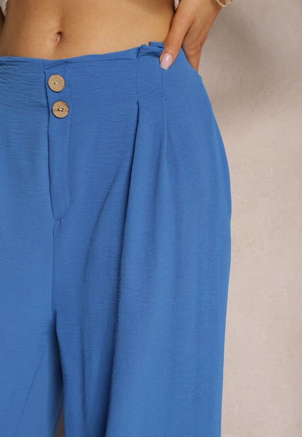 Renee - Niebieskie Spodnie w Stylu Alladynek High Waist Wykończone Gumką w Pasie Riselma. Okazja: na co dzień. Stan: podwyższony. Kolor: niebieski. Styl: sportowy, casual