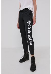columbia - Columbia Spodnie damskie kolor czarny z nadrukiem. Kolor: czarny. Materiał: dzianina. Wzór: nadruk