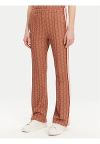 Lacoste Spodnie dresowe XF9313 Pomarańczowy Regular Fit. Kolor: pomarańczowy. Materiał: syntetyk, bawełna #1