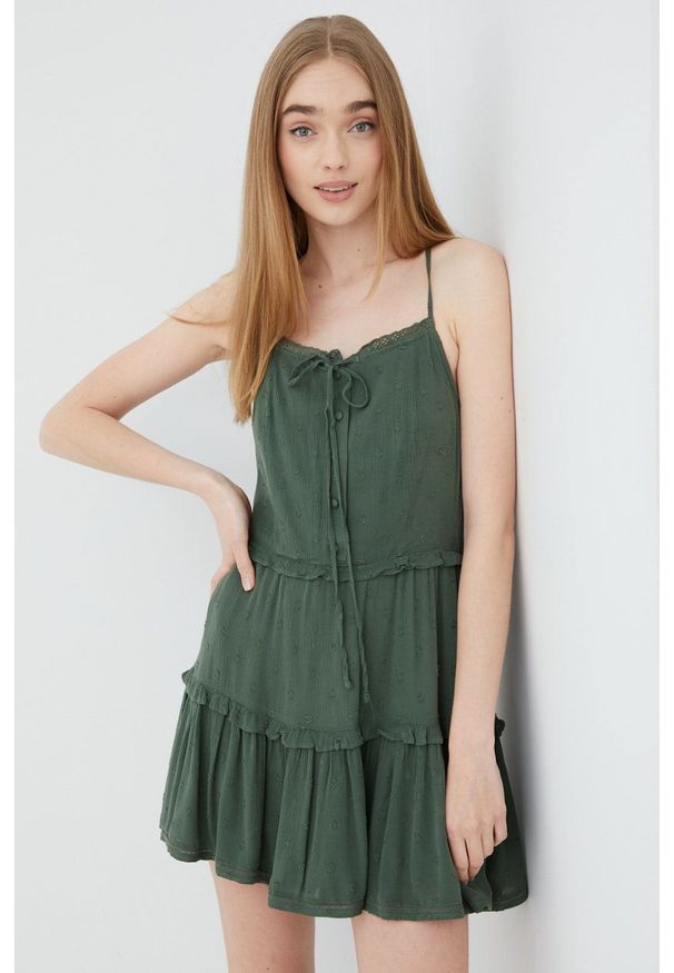 Superdry sukienka kolor zielony mini rozkloszowana. Kolor: zielony. Długość rękawa: na ramiączkach. Typ sukienki: rozkloszowane. Długość: mini