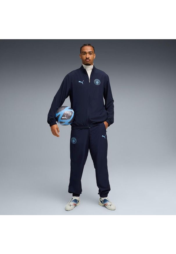 Puma - Dres Manchester City Woven 2025/26. Kolor: niebieski. Materiał: dresówka. Sport: piłka nożna