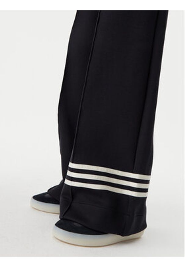 Adidas - adidas Spodnie dresowe adicolor Neuclassics JI8516 Czarny Loose Fit. Kolor: czarny. Materiał: syntetyk, bawełna