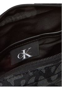 Calvin Klein Saszetka Slouched Monogram Mini Zip Fligh LV04G3175G Czarny. Kolor: czarny. Materiał: materiał #2