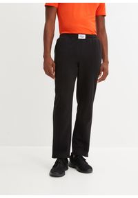 bonprix - Spodnie sportowe ze szwami dzielącymi. Kolor: czarny. Styl: sportowy #1