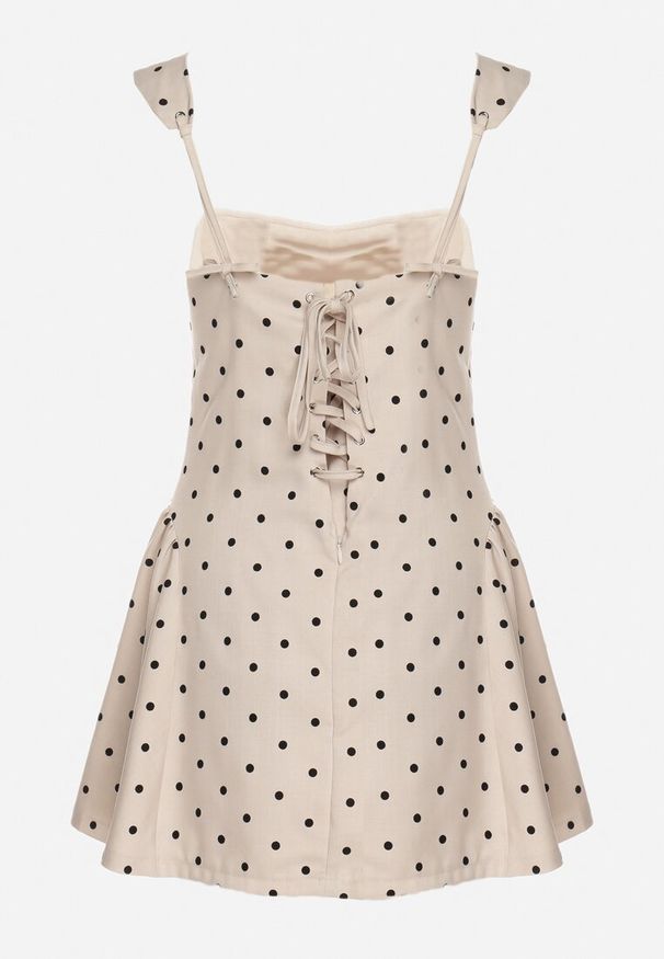 Born2be - Beżowa Sukienka Vices w Grochy o Rozkloszowanym Kroju z Wiązaniem na Ramiączkach Saririse. Okazja: na wesele, na ślub cywilny. Typ kołnierza: dekolt kwadratowy, dekolt gorset. Kolor: beżowy. Długość rękawa: na ramiączkach. Wzór: grochy. Typ sukienki: gorsetowe