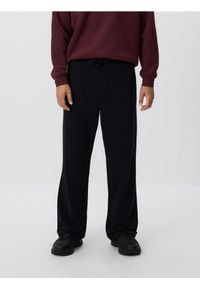 Reserved - Spodnie dresowe z bawełną - czarny. Kolor: czarny. Materiał: bawełna, dresówka #1