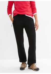 bonprix - Spodnie sportowe ocieplane, na miękkiej podszewce z polaru, szeroki fason. Kolor: czarny. Materiał: polar. Styl: sportowy #1