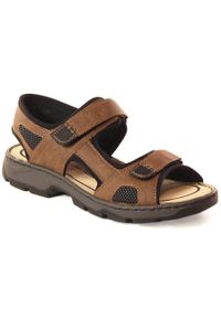 Komfortowe sandały męskie na rzepy brązowe Rieker 26156-25. Zapięcie: rzepy. Kolor: brązowy