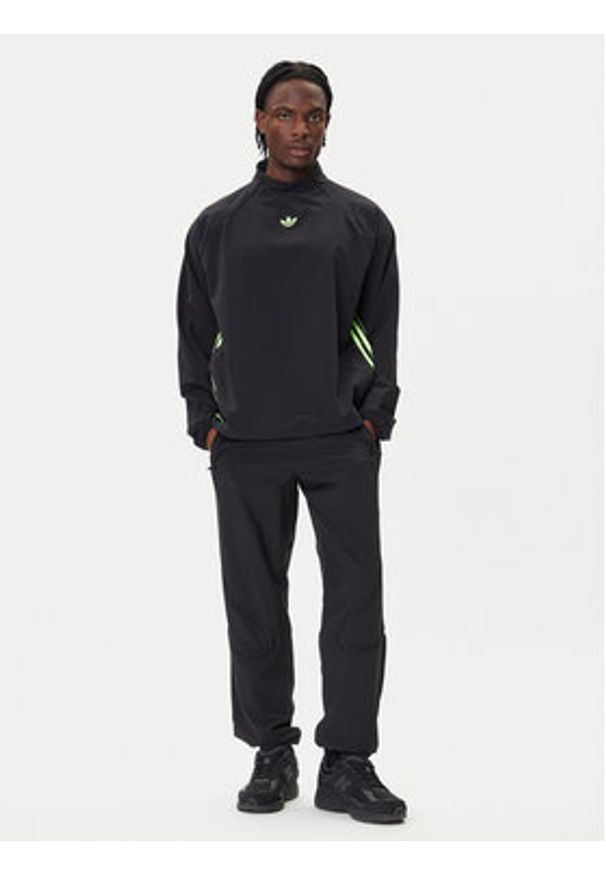 Adidas - adidas Bluza adicolor Woven Drill JW5957 Czarny Loose Fit. Kolor: czarny. Materiał: syntetyk