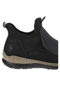 Czarne Botki Rieker Modne Wsuwane Obuwie Damskie. Okazja: na co dzień, na spacer. Zapięcie: bez zapięcia. Kolor: czarny. Materiał: materiał. Wzór: aplikacja. Styl: casual #5