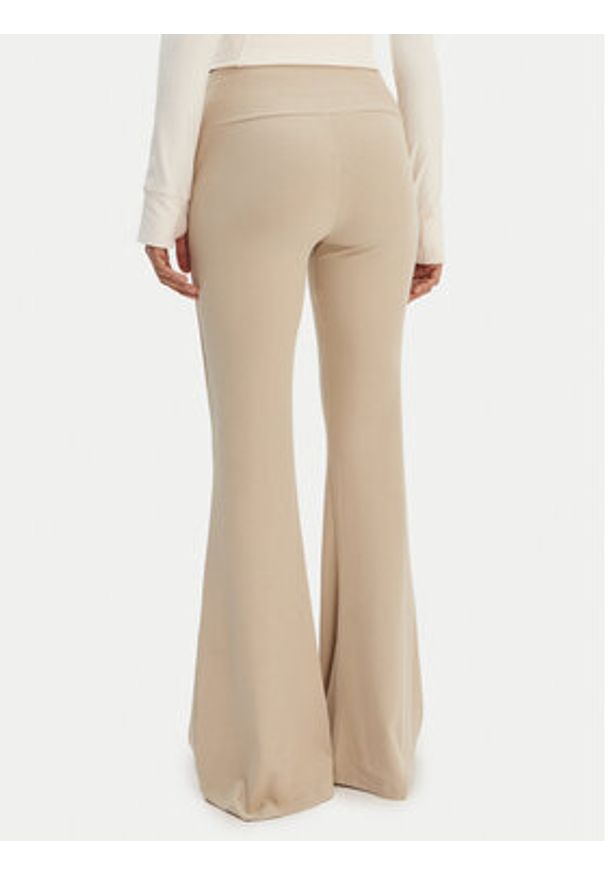 Adidas - adidas Legginsy Essentials KD3850 Beżowy Flared Leg. Kolor: beżowy. Materiał: wiskoza