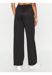 Calvin Klein Jeans Spodnie dresowe J20J221916 Czarny Relaxed Fit. Kolor: czarny. Materiał: syntetyk, dresówka