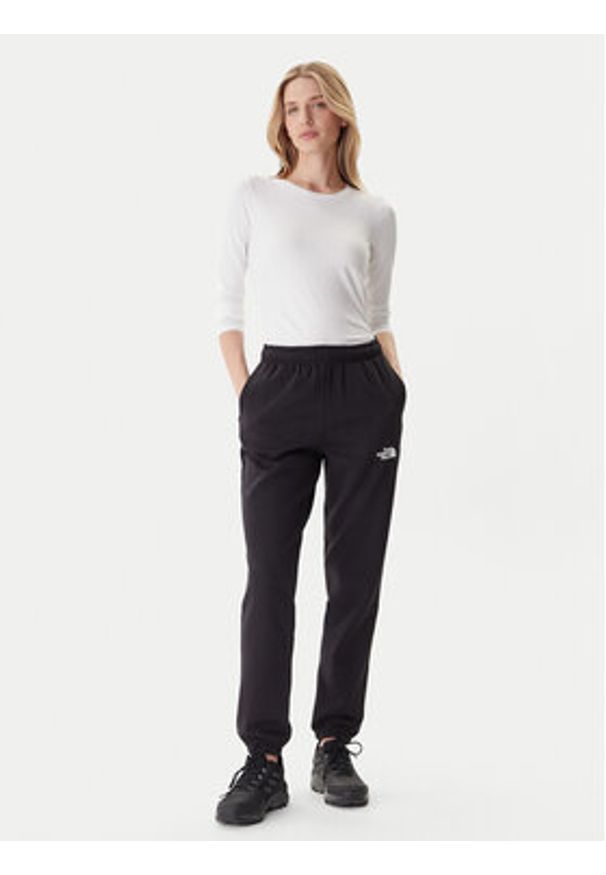 The North Face Spodnie dresowe Simple Dome NF0A8C1Y Czarny Regular Fit. Kolor: czarny. Materiał: syntetyk, bawełna
