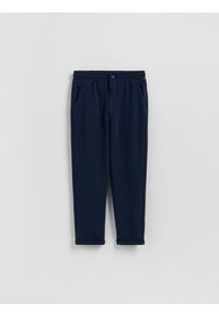 Reserved - BOYS` TROUSERS - granatowy. Kolor: niebieski. Materiał: dzianina, bawełna