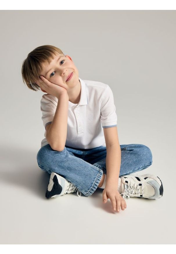 Reserved - Spodnie carrot fit - niebieski. Kolor: niebieski