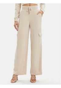 Juicy Couture Spodnie dresowe Audree JCWBJ23334 Beżowy Loose Fit. Kolor: beżowy. Materiał: syntetyk
