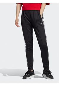 Adidas - adidas Spodnie dresowe adicolor IB5916 Czarny Slim Fit. Kolor: czarny. Materiał: dresówka, bawełna #1