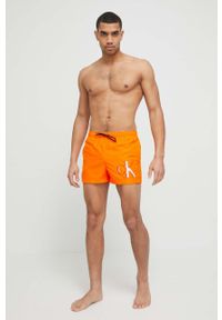 Calvin Klein szorty kąpielowe kolor pomarańczowy. Kolor: pomarańczowy. Materiał: tkanina, poliester, materiał. Wzór: nadruk #4