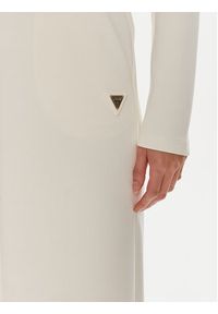 Guess Spodnie dresowe Olympe V4YB07 KCAY2 Beżowy Relaxed Fit. Kolor: beżowy. Materiał: syntetyk