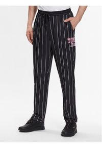 Tommy Jeans Spodnie dresowe Ethan DM0DM16339 Czarny Regular Fit. Kolor: czarny. Materiał: syntetyk, dresówka