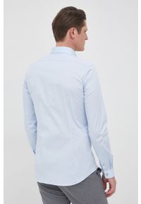Calvin Klein koszula męska slim z kołnierzykiem klasycznym. Typ kołnierza: kołnierzyk klasyczny. Kolor: niebieski. Materiał: tkanina, bawełna. Długość rękawa: długi rękaw. Długość: długie. Styl: klasyczny