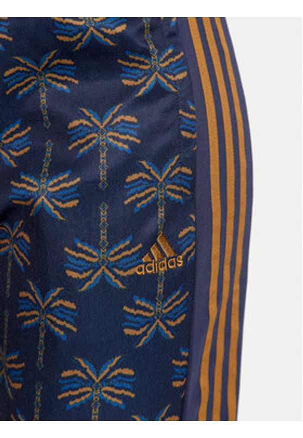 Adidas - adidas Spodnie dresowe FARM Rio Tiro IV9754 Granatowy Regular Fit. Kolor: niebieski. Materiał: bawełna
