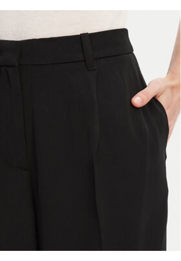 TOMMY HILFIGER - Tommy Hilfiger Spodnie materiałowe WW0WW46749 Czarny Relaxed Fit. Kolor: czarny. Materiał: wiskoza