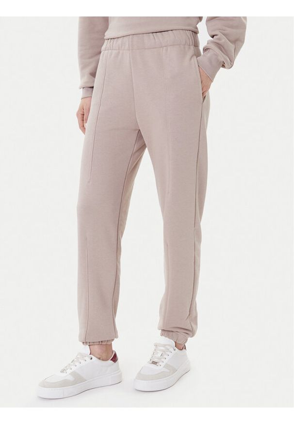 On Spodnie dresowe Club Pants 1WE1005 Beżowy Relaxed Fit. Kolor: beżowy. Materiał: bawełna