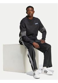 Adidas - adidas Spodnie dresowe adicolor Firebird IZ4801 Czarny Baggy Fit. Kolor: czarny. Materiał: syntetyk, bawełna #3