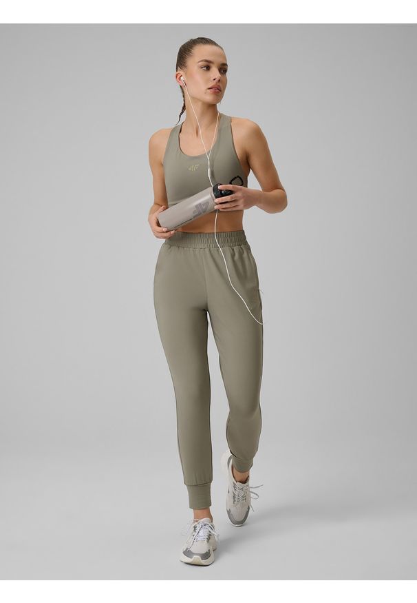 4f - 4F Spodnie treningowe szybkoschnące damskie - oliwkowe S. Kolor: oliwkowy, brązowy, wielokolorowy. Materiał: włókno. Sport: fitness