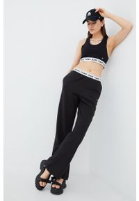 Tommy Jeans spodnie dresowe damskie kolor czarny gładkie. Kolor: czarny. Materiał: dresówka. Wzór: gładki