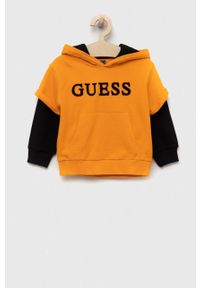 Guess bluza bawełniana dziecięca kolor pomarańczowy z kapturem wzorzysta. Okazja: na co dzień. Typ kołnierza: kaptur. Kolor: pomarańczowy. Materiał: bawełna. Styl: casual