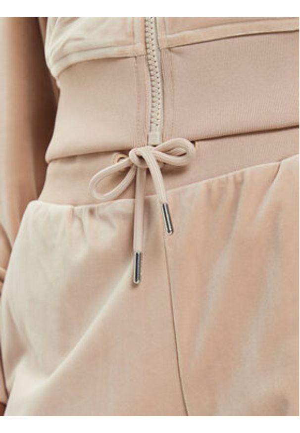 Guess Spodnie dresowe V3BB27 KBXI2 Beżowy Regular Fit. Kolor: beżowy. Materiał: syntetyk