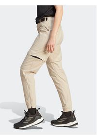 Adidas - adidas Spodnie dresowe Terrex Utilitas Hiking Zip-Off Tracksuit Bottoms HZ9046 Beżowy Regular Fit. Kolor: beżowy. Materiał: syntetyk #5