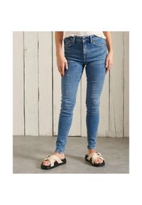Spodnie turystyczne damskie Superdry High Rise Skinny. Kolor: niebieski. Materiał: elastan, poliester, bawełna. Sport: fitness