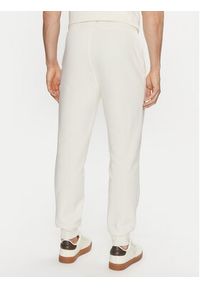 Calvin Klein Jeans Spodnie dresowe Monologo Hwk Pant J30J325658 Écru Regular Fit. Materiał: bawełna, syntetyk