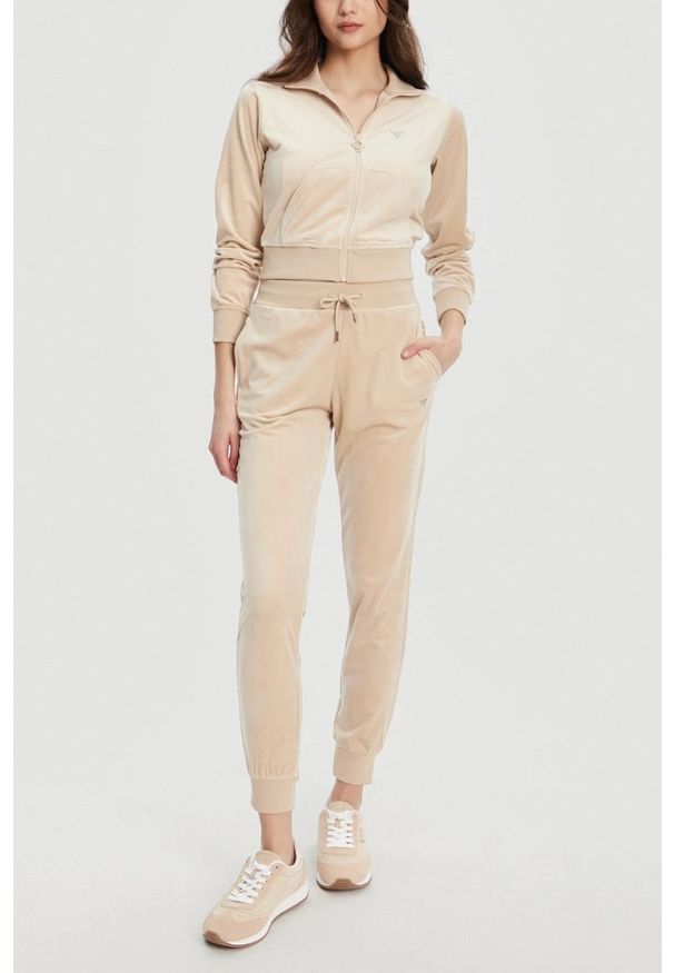 Guess - GUESS Beżowe damskie spodnie dresowe Couture, Rozmiar S. Kolor: beżowy. Materiał: dresówka