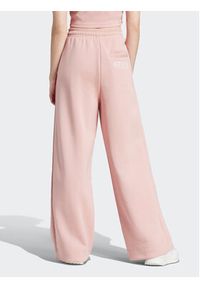Adidas - adidas Spodnie dresowe IR8378 Różowy Loose Fit. Kolor: różowy. Materiał: bawełna