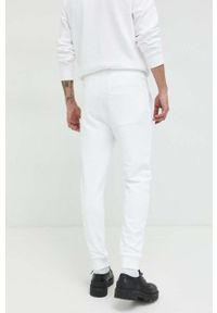 Hugo - HUGO spodnie dresowe bawełniane męskie kolor biały gładkie. Kolor: biały. Materiał: bawełna, dresówka. Wzór: gładki #2