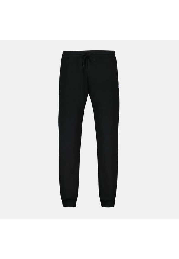 Spodnie Le Coq Sportif Model Loose Kolor Czarny. Kolor: czarny. Materiał: tkanina. Długość: krótkie. Sezon: lato