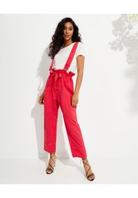ISABEL MARANT - Czerwone spodnie na szelkach Fineba. Stan: podwyższony. Kolor: czerwony. Materiał: materiał. Wzór: aplikacja