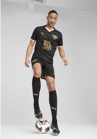Puma - Męska koszulka wyjazdowa Palermo F.C. 24/25 PUMA Black Gold. Kolor: żółty, wielokolorowy, czarny. Materiał: materiał