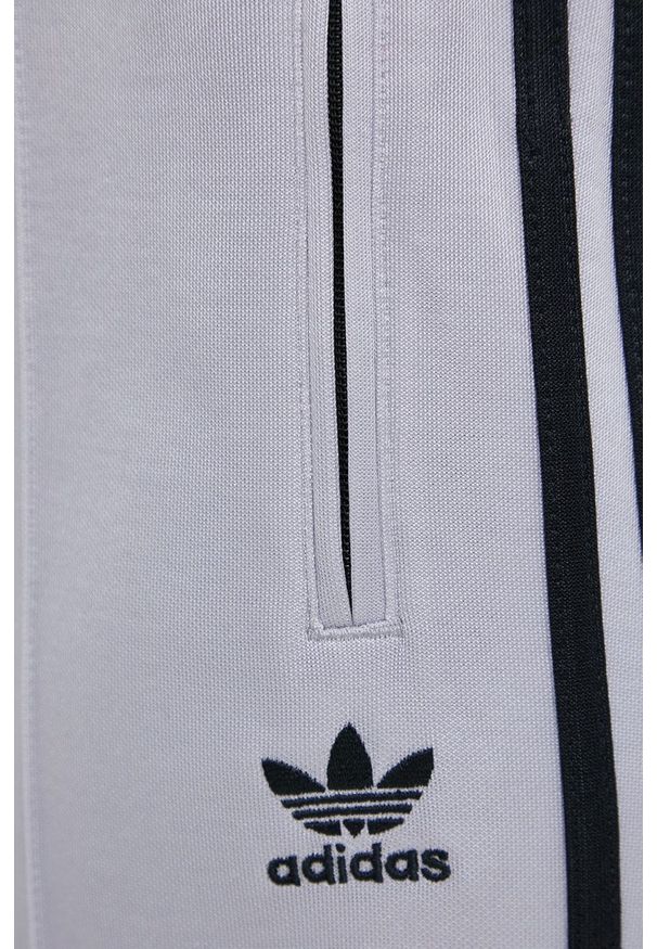 adidas Originals Spodnie damskie kolor srebrny gładkie. Kolor: srebrny. Materiał: dzianina, poliester. Wzór: gładki