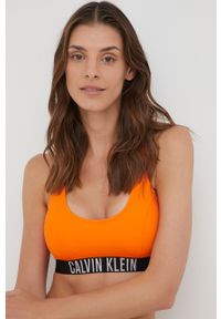Calvin Klein biustonosz kąpielowy kolor pomarańczowy lekko usztywniona miseczka. Kolor: pomarańczowy. Materiał: materiał, dzianina