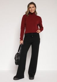 Born2be - Czarne Dzianinowe Spodnie o Szerokim Kroju ze Sznurkami Melatusa. Okazja: na co dzień. Stan: podwyższony. Kolor: czarny. Materiał: dzianina. Styl: klasyczny, casual, elegancki #7