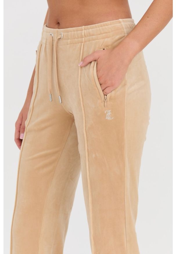 Juicy Couture - JUICY COUTURE Beżowe damskie spodnie dresowe Tina Track Pants, Rozmiar L. Kolor: beżowy. Materiał: dresówka