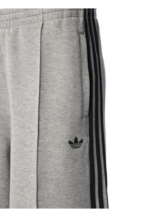 Adidas - adidas Spodnie dresowe adicolor Spacer 3-Stripes JV7497 Zielony Wide Leg. Kolor: zielony. Materiał: bawełna. Sport: turystyka piesza