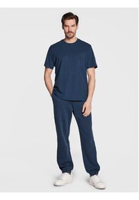 Champion Spodnie dresowe 217896 Granatowy Regular Fit. Kolor: niebieski. Materiał: dresówka, bawełna #3
