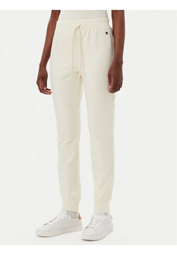 Champion Spodnie dresowe 118101 Écru Slim Fit. Materiał: bawełna